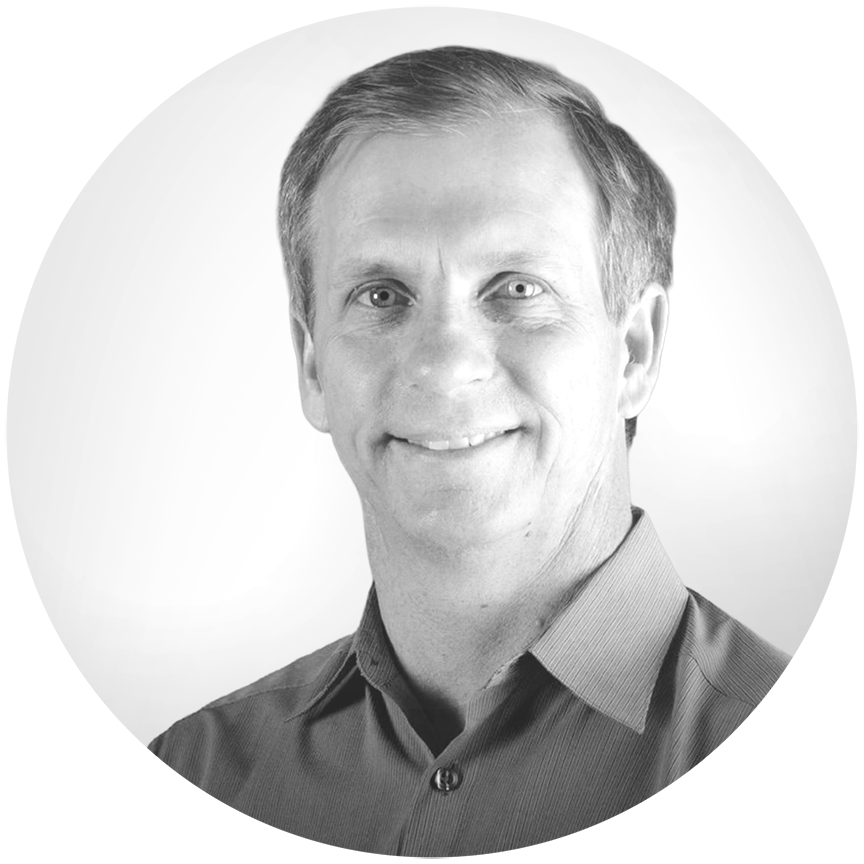 Black and white circular photo of Alan Eustace